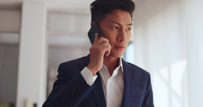 Phone call, business and asian man walking in office for communication, company negotiation and mobile networking. Young stock market trader talking on smartphone for corporate deal, sale and trading