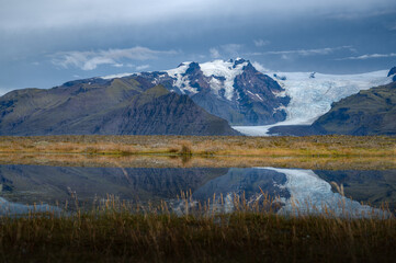 Vatnajokull Icelandic's volcanic landscape and it's glaciers in the distance. With the reflection in the water.