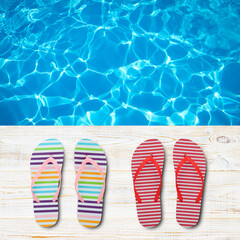 Naklejka premium Beach accessories flip flops on wooden desk, sea water background. Summer resort objects