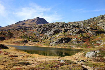 View on a lake in the Simplon Pass is a high mountain pass between the Pennine Alps and the Lepontine Alps in Switzerland.