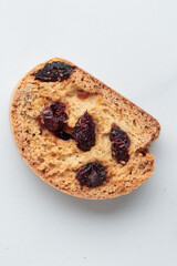 Biscotti cantucci cookies with almond and cranberry on white background top view