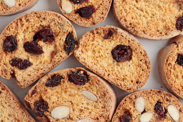 Biscotti cantucci cookies with almond and cranberry on white background top view