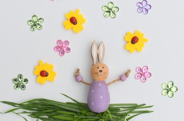 Young Hare, Easter bunny sitting on green meadow