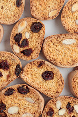 Biscotti cantucci cookies with almond and cranberry on white background top view