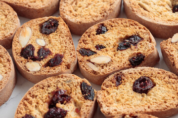 Biscotti cantucci cookies with almond and cranberry on white background