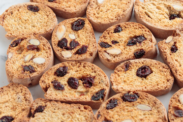 Biscotti cantucci cookies with almond and cranberry on white background