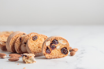 Biscotti cantucci cookies with almond and cranberry on white background