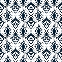 Fabric ethnic geometric pattern design for background or wallpaper,Ikat geometric folklore ornament. Tribal ethnic texture. Seamless striped pattern in Aztec