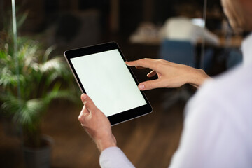 Close up of man using digital tablet.