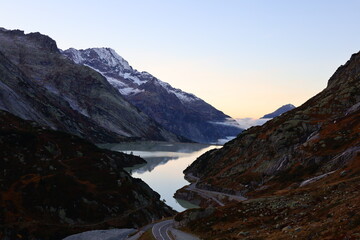 Fototapeta na wymiar View on a lake in the Grimsel Pass which is a mountain pass in Switzerland, crossing the Bernese Alps at an elevation of 2,164 metres
