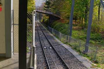 Fototapeta na wymiar Mountain station of funicular at village of Evilard, Canton Bern, on a sunny autumn day. Photo taken November 10th, 2022, Evilard, Switzerland.