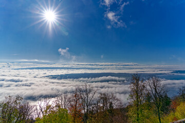 Aerial view from village Magglingen Macolin, Canton Bern, over Lake Biel Bienne with Aare River and fog on a blue cloudy autumn day. Photo taken November 10th, 2022, Magglingen, Switzerland.