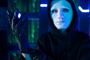 A Hacker is using laptop computer to steal data in the night