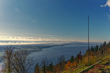 Aerial view from village Magglingen Macolin, Canton Bern, over City of Biel Bienne and lake with Aaare River on a blue cloudy autumn day. Photo taken November 10th, 2022, Magglingen, Switzerland.