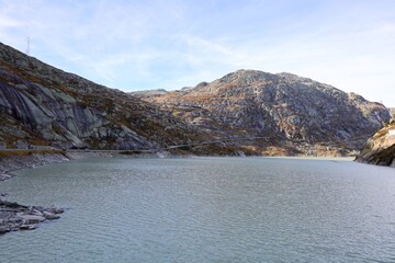 View on a lake in the Grimsel Pass which is a mountain pass in Switzerland, crossing the Bernese...