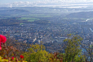 Aerial view from village Magglingen Macolin, Canton Bern, over City of Biel Bienne and lake with Aaare River on a blue cloudy autumn day. Photo taken November 10th, 2022, Magglingen, Switzerland.
