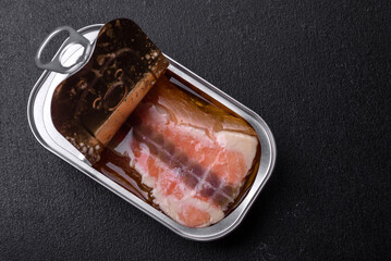Tin or aluminum rectangular can of canned salmon with a key