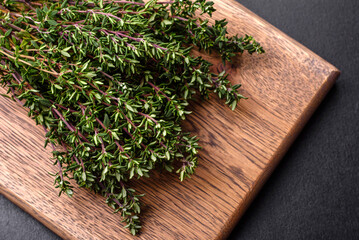 Bunch of fresh picked thyme on a dark concrete background