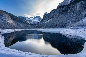 Beautiful snowy winter landscape with Dachstein mountain and Gosausee in Austria near Hallstatt