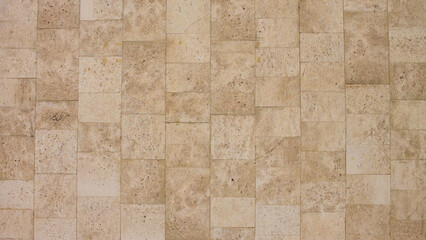 Fototapeta premium old beige stone tile wall