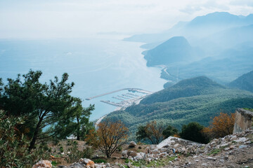 Obraz premium Antalya Turkey from the top of the hill. Misty weather on the coast of the sea. Mediterranean sea concept. 