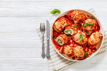 tasty chicken rollatini in tomato sauce, top view
