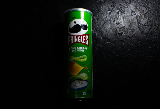 LVIV, UKRAINE - December 20, 2022 : Pringles potato chips with sour cream and onion.