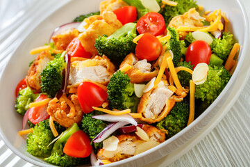 fried chicken tenders broccoli salad in bowl