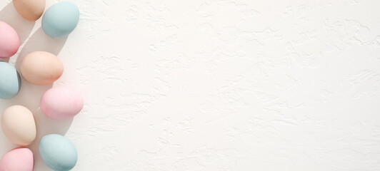 Colorful eggs on white texture. Easter background