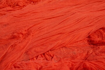 Roter textiler Hintergrund drapiert 