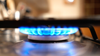 The flame of a gas stove in the kitchen - travel photography