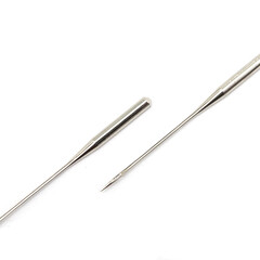 Two steel sewing needles lying parallel to each other, located diagonally. Fashionable square composition, two sewing needles isolated on a white background