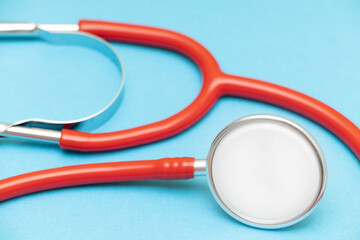 medical stethoscope on a blue background shot with blur.