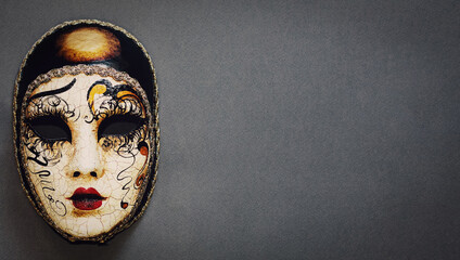 Vintage carnival venetian mask on a gray background. Concept - Venice carnival-masquerade,...