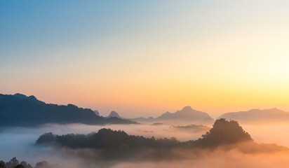 Fototapeta na wymiar Landscape of mountains range at sunrise with morning fog for mountain background.