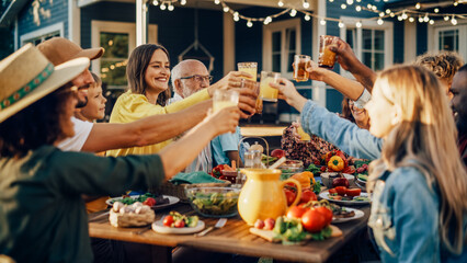 Family and Multicultural Diverse Friends Gathering Together at a Garden Dinner Party. Old and Young People Raising and Toasting Glasses with Fresh Orange Juice and Celebrating the Occasion.