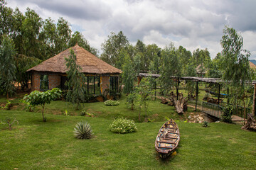 African lodge for tourists, with round shaped traditional houses called Tukul, with colorful...