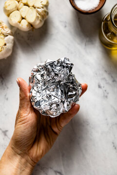 Home baked garlic cloves in baking foil