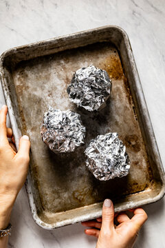 Home baked garlic cloves in baking foil
