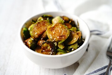 Roasted Teriyaki Brussels sprouts served in a bowl, selective focus