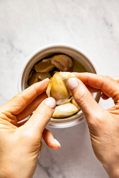 Home baked garlic cloves in a bowl
