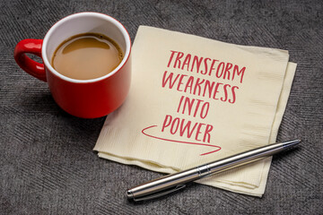 transform weakness into power - inspirational advice on a napkin with coffee, success and personal development concept