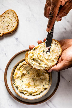Homemade garlic butter on a chopping board