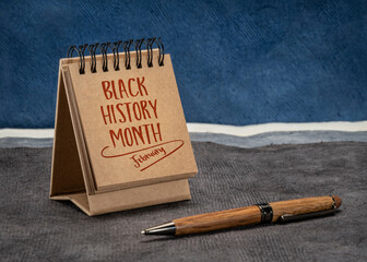 February - Black History Month, handwriting in a desktop calendar, an annual observance originating...