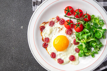 fried eggs vegetables, sausages breakfast fresh healthy meal food snack on the table copy space food background rustic top view