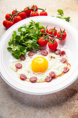 fried eggs vegetables, sausages breakfast fresh healthy meal food snack on the table copy space food background rustic top view