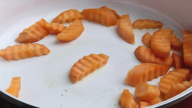 Sliced carrot strips fried in oil