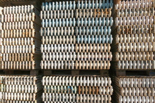 Heavy duty radiators. Old stacked scrap panel radiators. Iron ecycling radiators in scrap dealers site.
