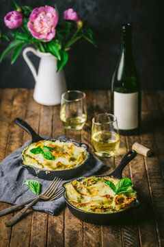 Baked Pasta in two small Skillets with Wine and Flowers