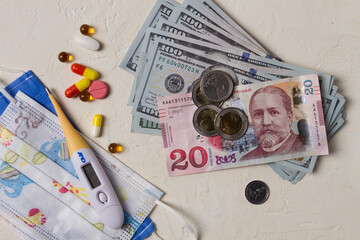 Georgian monetary currency, Lari, 20 GEL, medicine, thermometer, protective medical masks, concept,...